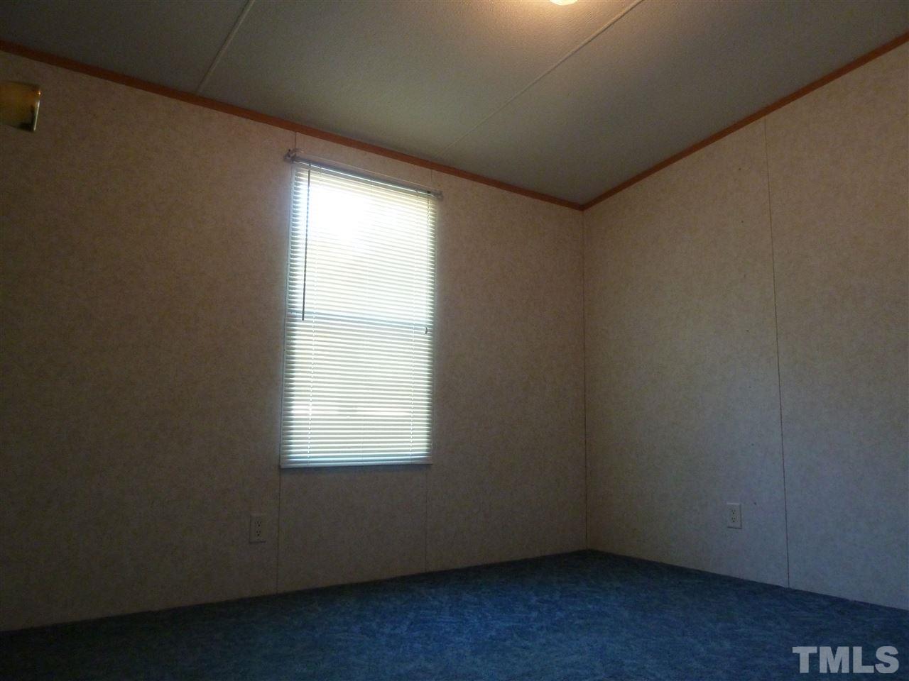 162 Isaac Trail Roxboro, NC 27574 - Photo 18 of 20 an empty room with a window