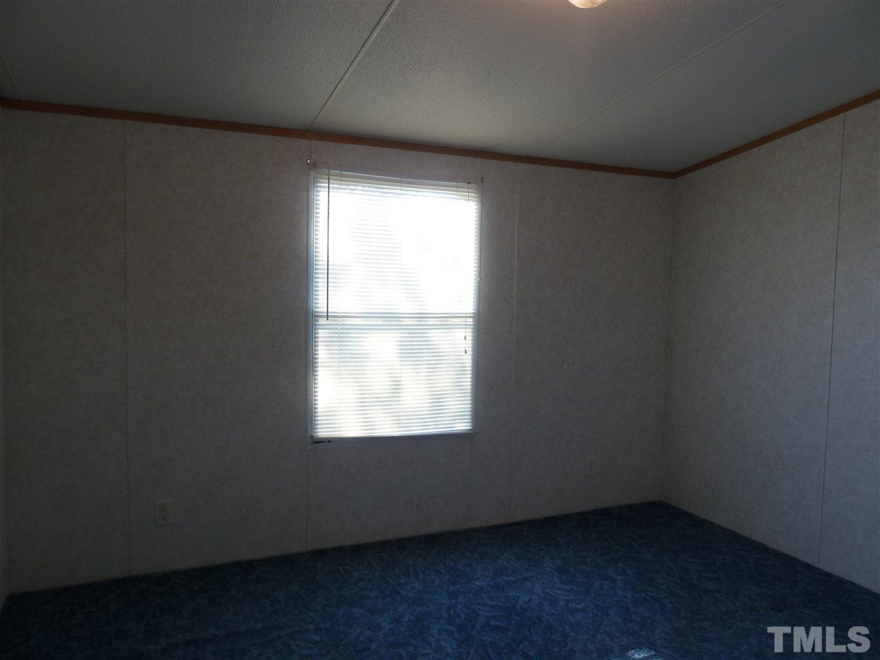 162 Isaac Trail Roxboro, NC 27574 - Photo 20 of 20 an empty room with a window