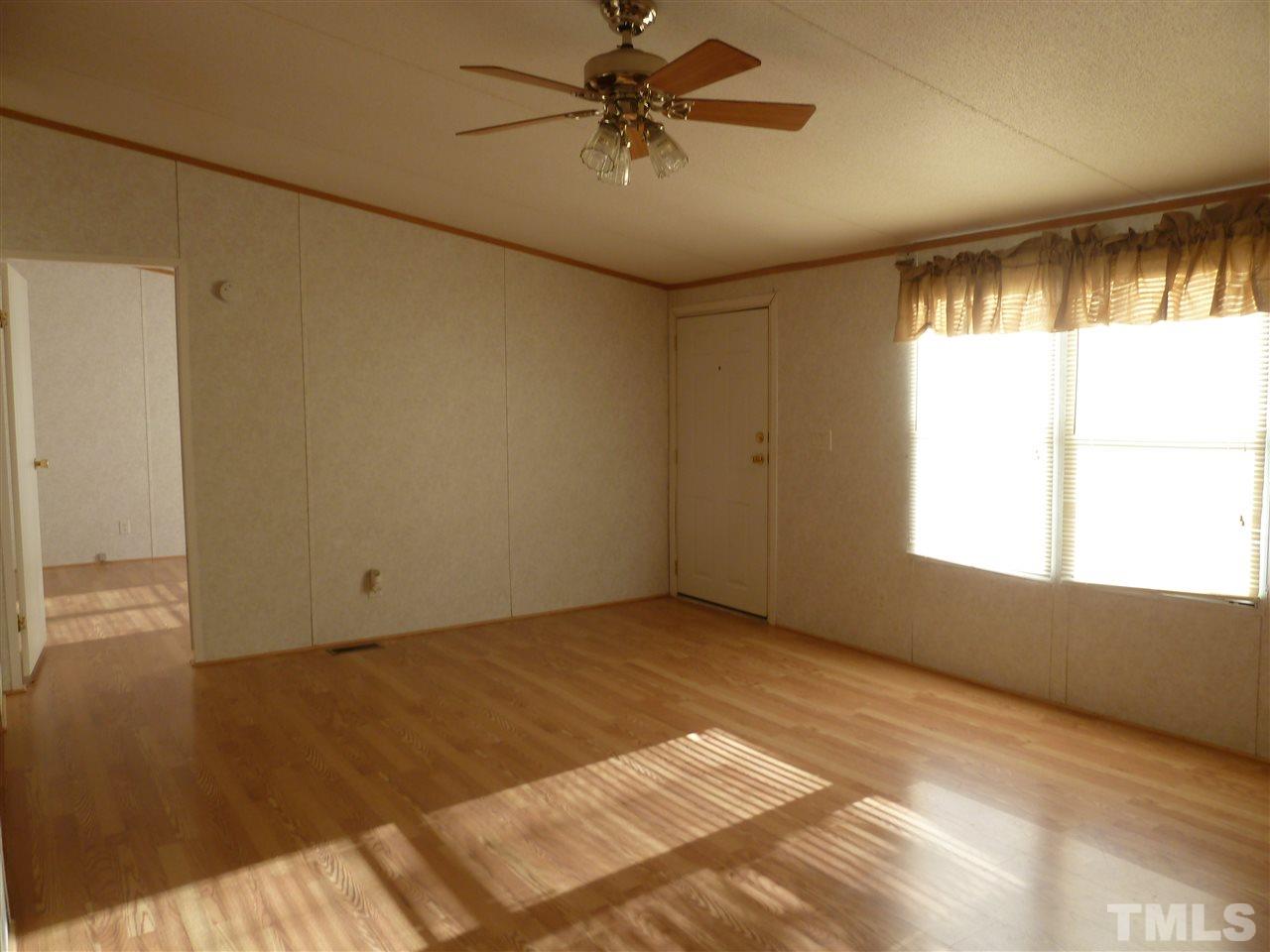 162 Isaac Trail Roxboro, NC 27574 - Photo 9 of 20 a view of an empty room with a window