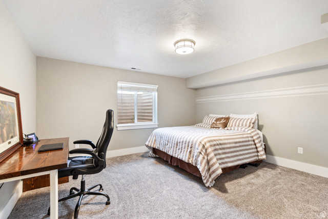 580 Cherry Ridge Lane Richmond, UT 84333 - Photo 42 of 53 Bedroom featuring a desk and light carpet
