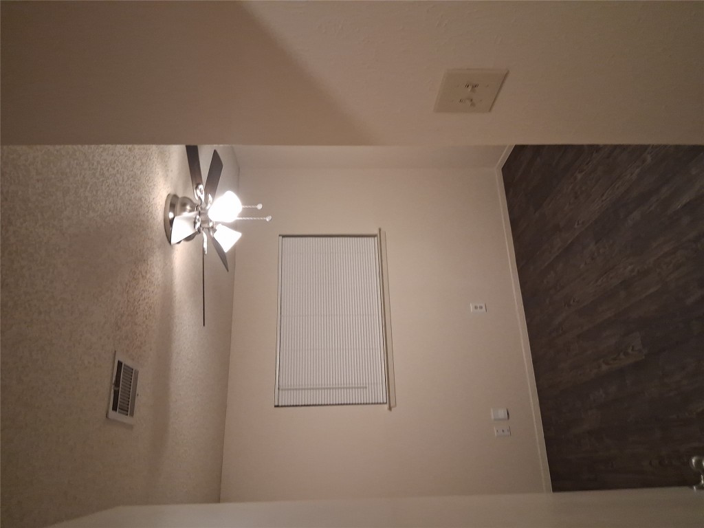 703 Rollingway Drive, Unit B Round Rock, TX 78681 - Photo 5 of 8 a view of a room with a fan