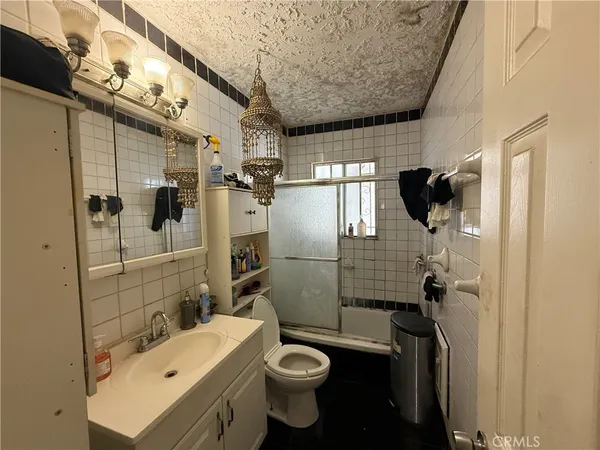 a kitchen with stainless steel appliances a refrigerator and a stove