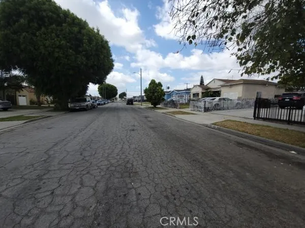 a view of street with parked cars