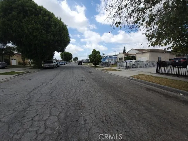 a view of street with parked cars