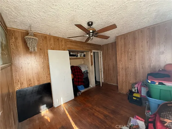 a view of room with hardwood floor and window