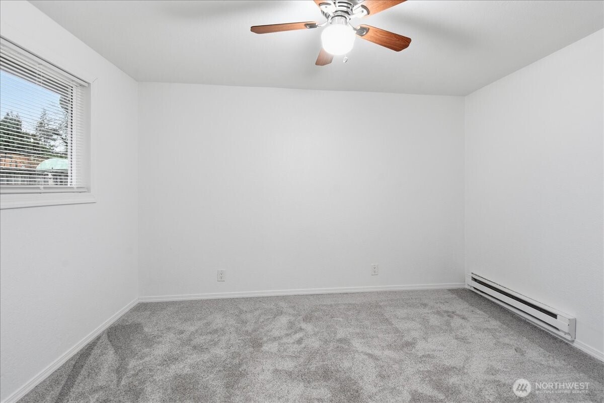4404 Southeast 3rd Place Renton, WA 98059 - Photo 12 of 27 an empty room with a window