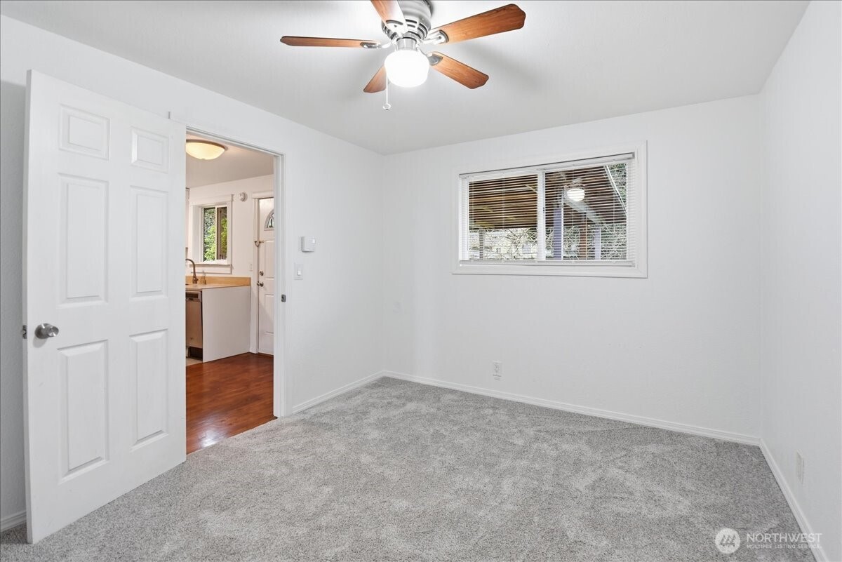 4404 Southeast 3rd Place Renton, WA 98059 - Photo 14 of 27 an empty room with closet and windows