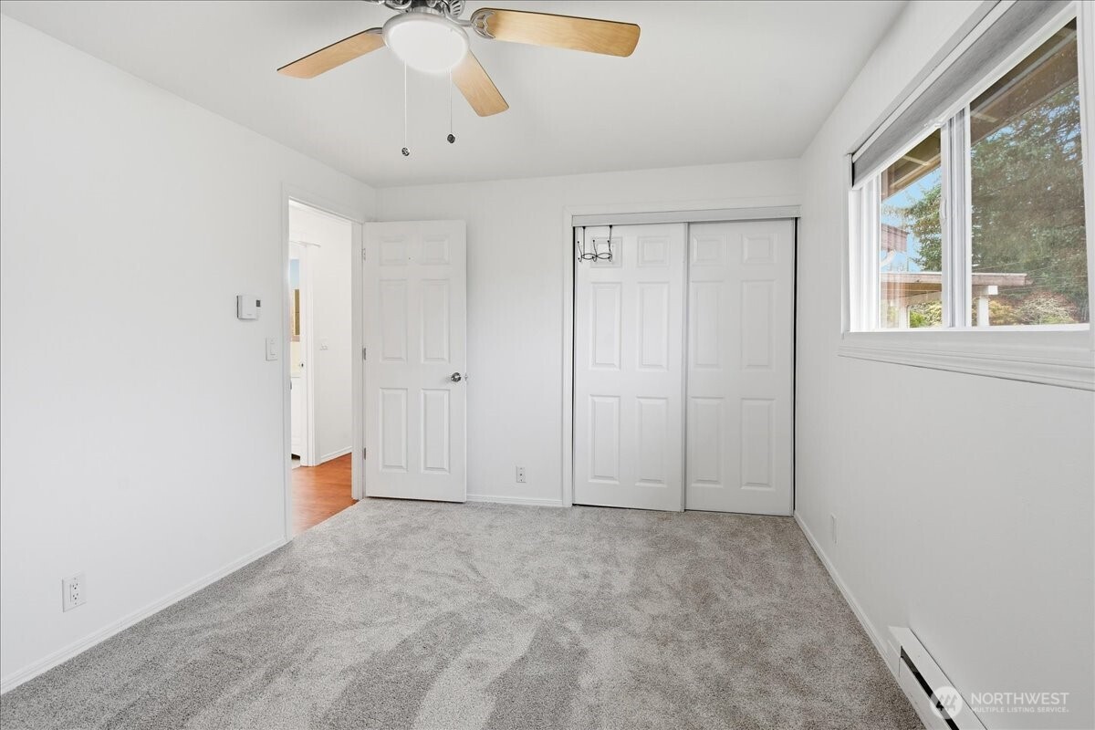 4404 Southeast 3rd Place Renton, WA 98059 - Photo 18 of 27 an empty room with a empty space and windows