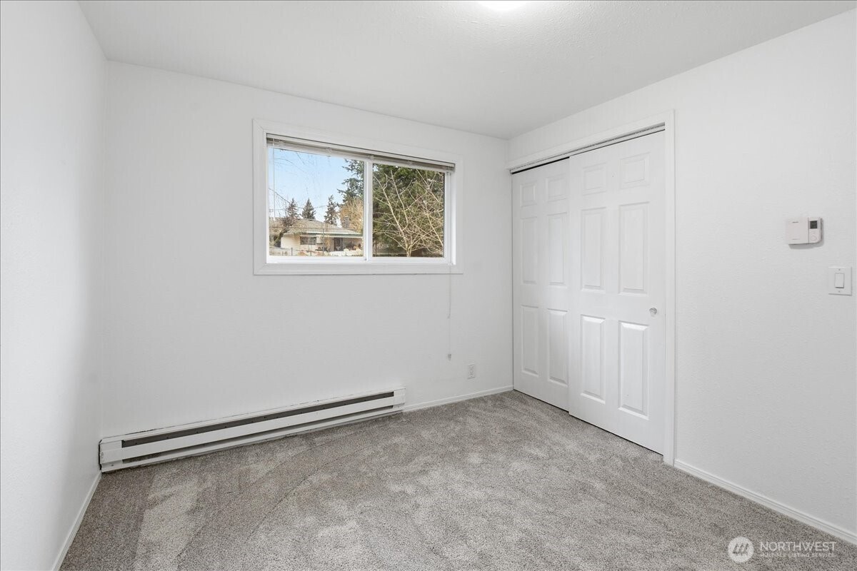 4404 Southeast 3rd Place Renton, WA 98059 - Photo 20 of 27 an empty room with a window