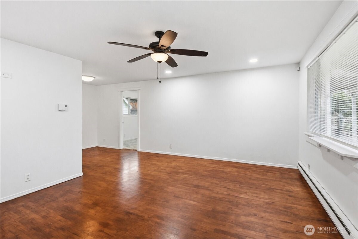 4404 Southeast 3rd Place Renton, WA 98059 - Photo 3 of 27 wooden floor in an empty room with a window
