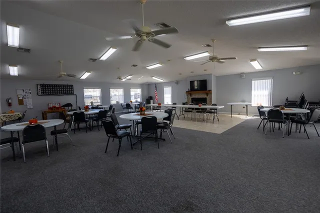 a group of people sitting in living room