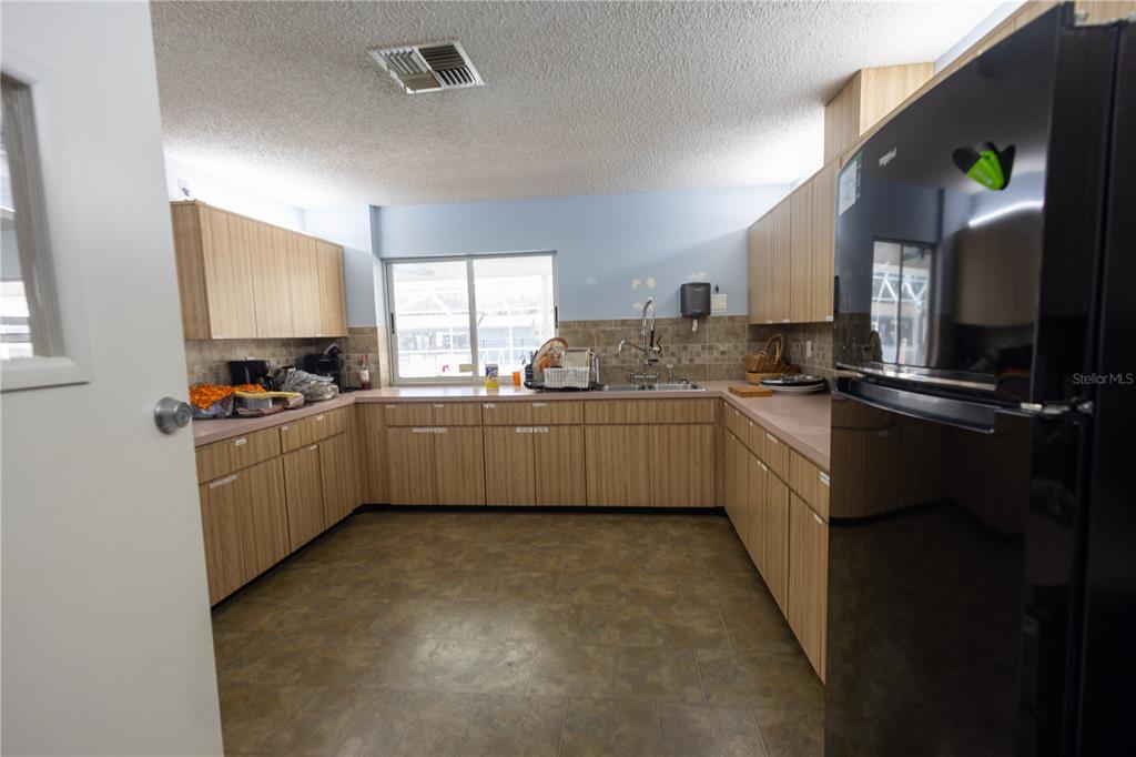 0 Forest Glenn Drive Spring Hill, FL 34607 - Photo 16 of 31 a kitchen with a sink a counter top space cabinets and appliances