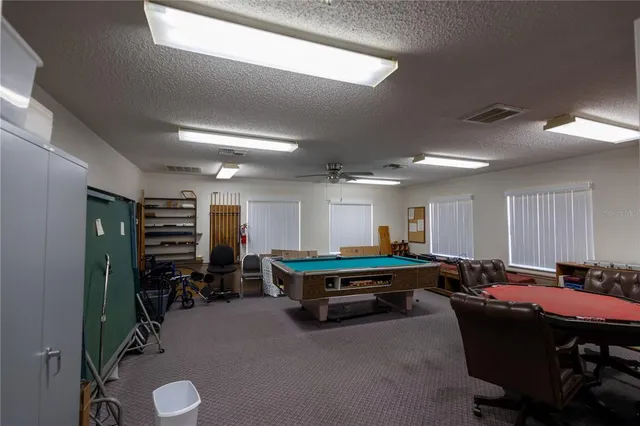 a room with furniture and gym equipment