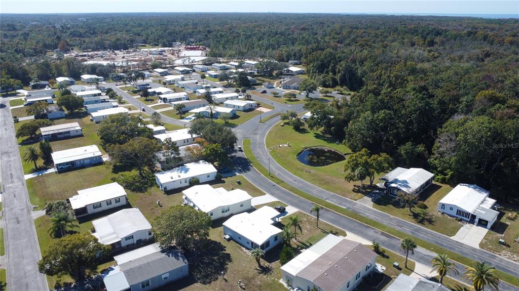 0 Forest Glenn Drive Spring Hill, FL 34607 - Photo 6 of 31 an aerial view of a house with a swimming pool yard and mountain view in back
