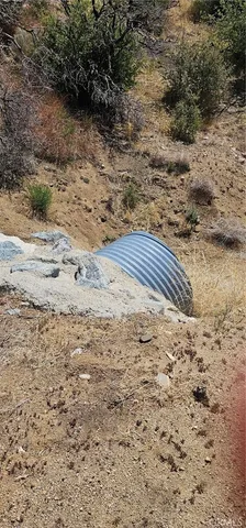 a view of a field with an ocean view