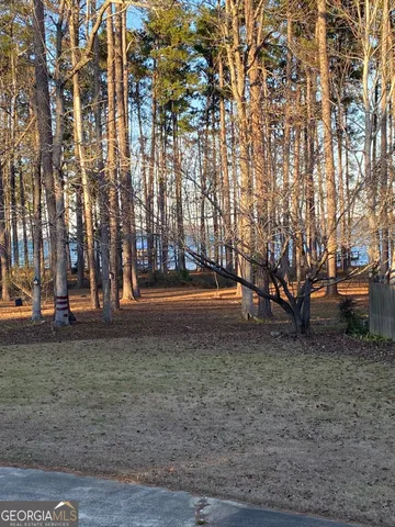 a view of a living room with kitchen