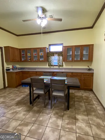 a living room with a table and chairs