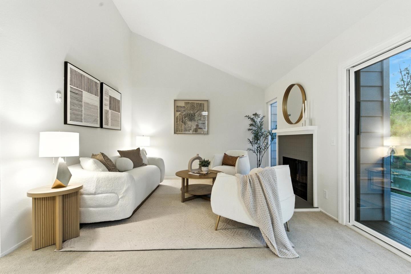 a living room with furniture a lamp and a fireplace