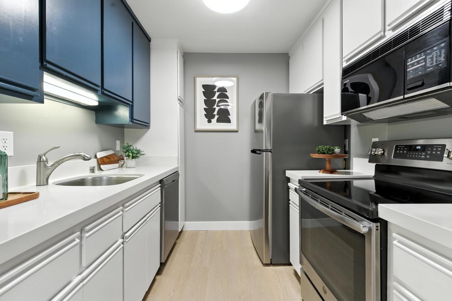905 West Middlefield Road, Unit 974 Mountain View, CA 94043 - Photo 11 of 20 a kitchen with stainless steel appliances granite countertop a refrigerator sink and stove