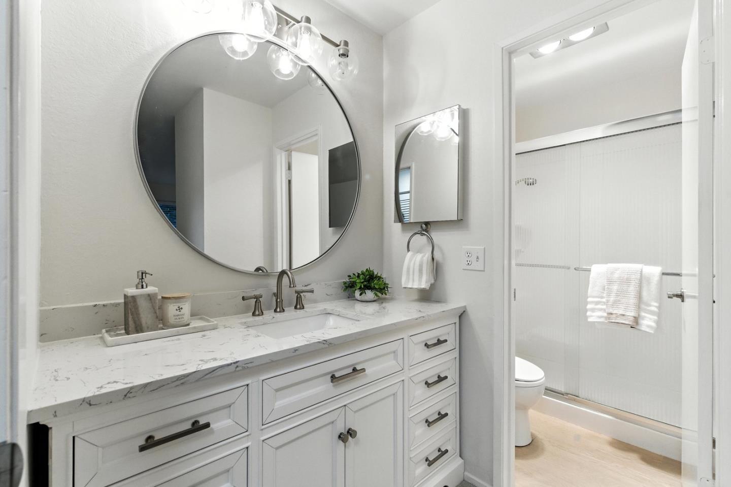 905 West Middlefield Road, Unit 974 Mountain View, CA 94043 - Photo 13 of 20 a bathroom with a double vanity sink and a mirror