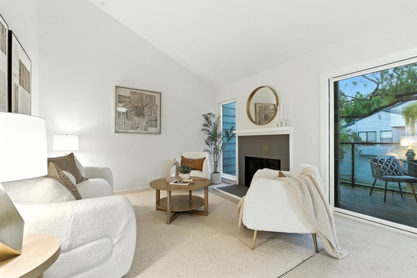 905 West Middlefield Road, Unit 974 Mountain View, CA 94043 - Photo 2 of 20 a living room with furniture and a fireplace