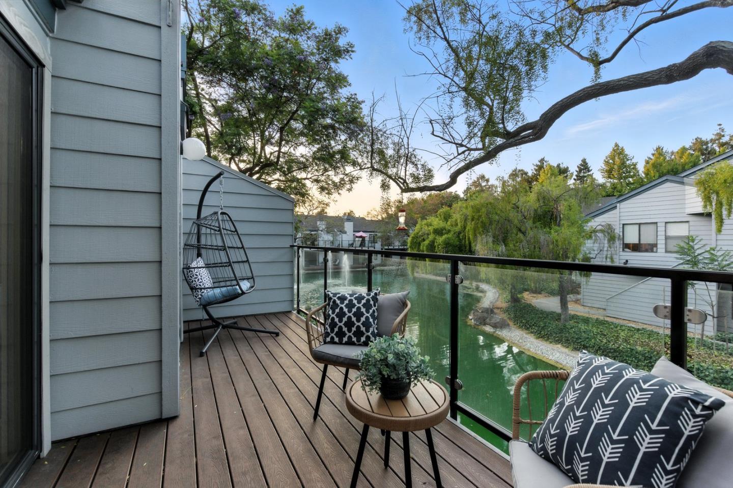 905 West Middlefield Road, Unit 974 Mountain View, CA 94043 - Photo 4 of 20 a balcony with wooden floor and outdoor seating