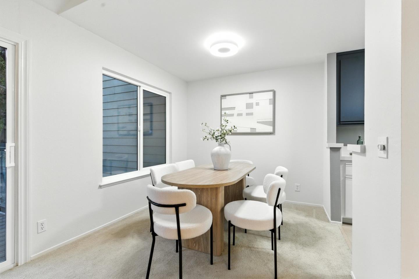 905 West Middlefield Road, Unit 974 Mountain View, CA 94043 - Photo 7 of 20 a view of a dining room with furniture and window