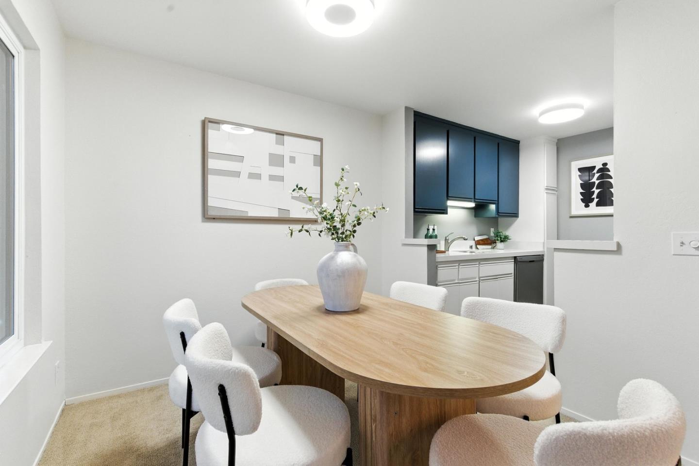 905 West Middlefield Road, Unit 974 Mountain View, CA 94043 - Photo 8 of 20 a dining room with furniture and window