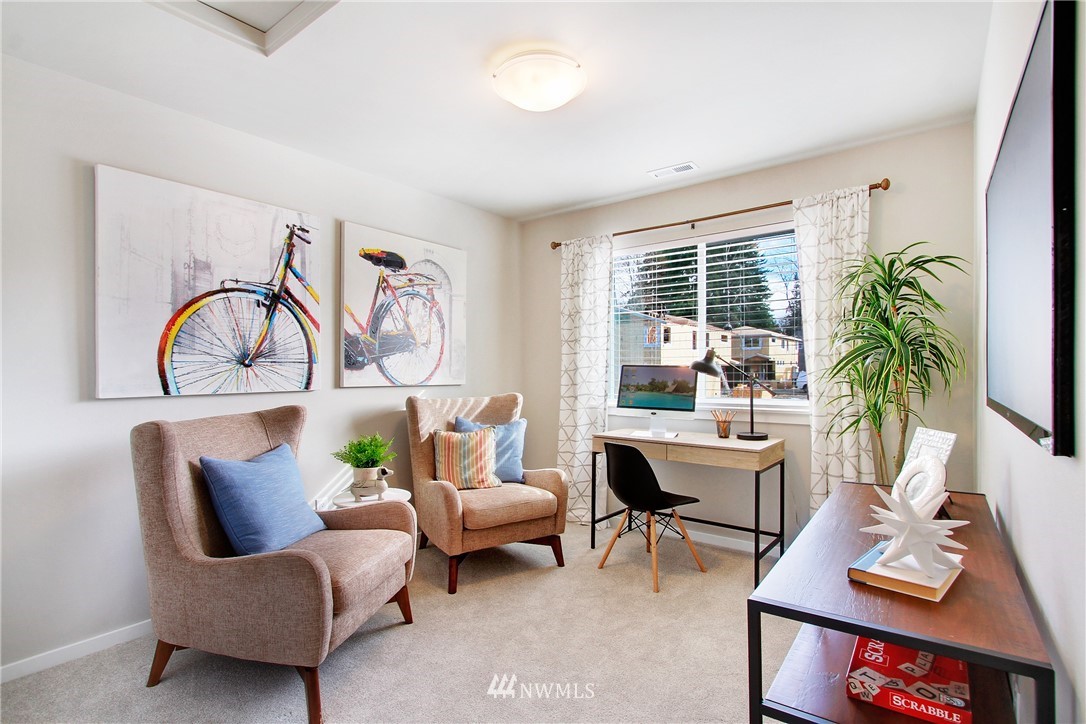 18631 Meridian Place West, Unit CC 10 Bothell, WA 98012 - Photo 20 of 27 a living room with furniture a rug and a window