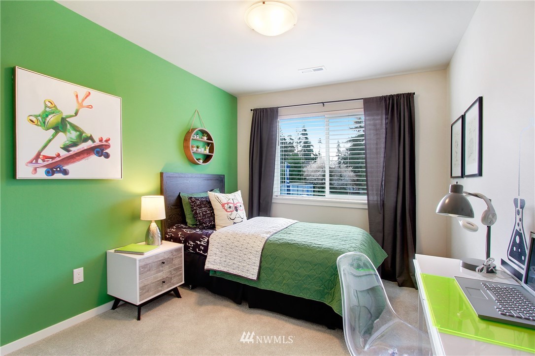 18631 Meridian Place West, Unit CC 10 Bothell, WA 98012 - Photo 21 of 27 a bedroom with a bed wooden floor and window