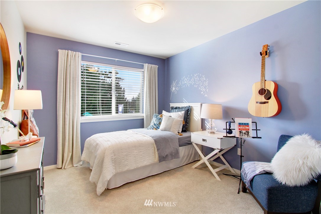 18631 Meridian Place West, Unit CC 10 Bothell, WA 98012 - Photo 23 of 27 a bedroom with bed and a window