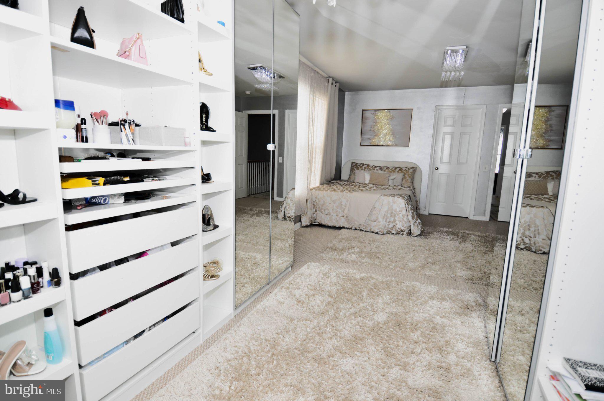 17143 Gibson Mill Road Dumfries, VA 22026 - Photo 32 of 35 Stylish bedroom with mirrored elegance.