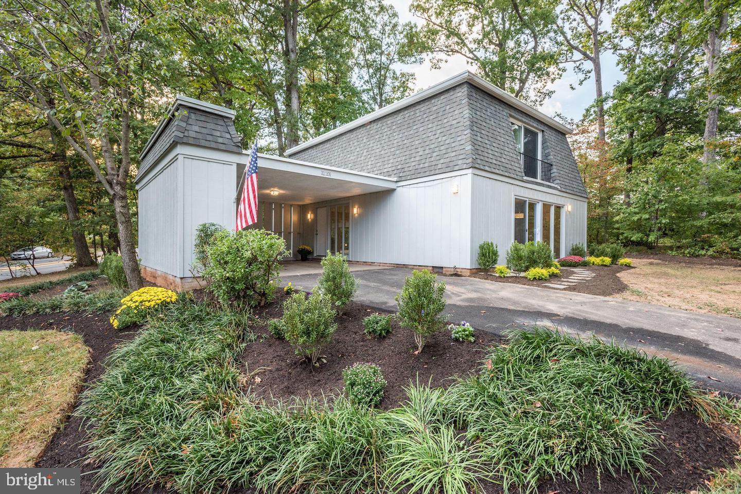11201 Wedge Drive Reston, VA 20190 - Photo 2 of 31 a front view of a house with garden