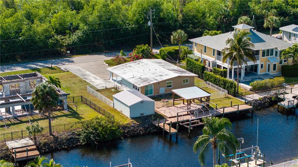 5800 Park Road Fort Myers, FL 33908 - Photo 11 of 18 an aerial view of a house with swimming pool and outdoor seating