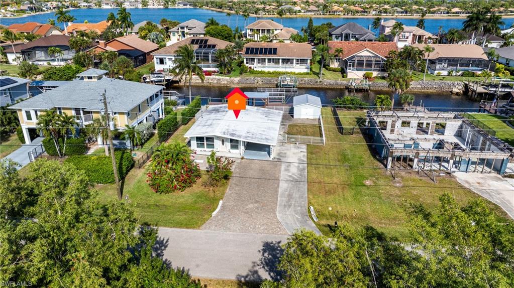 5800 Park Road Fort Myers, FL 33908 - Photo 2 of 18 an aerial view of residential houses with outdoor space and swimming pool