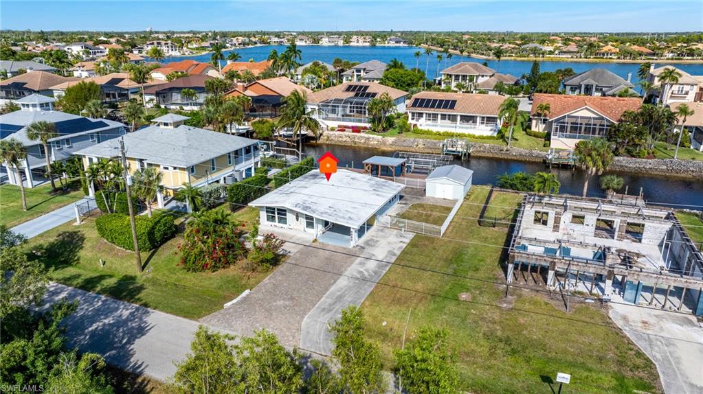5800 Park Road Fort Myers, FL 33908 - Photo 3 of 18 an aerial view of residential houses with outdoor space and swimming pool