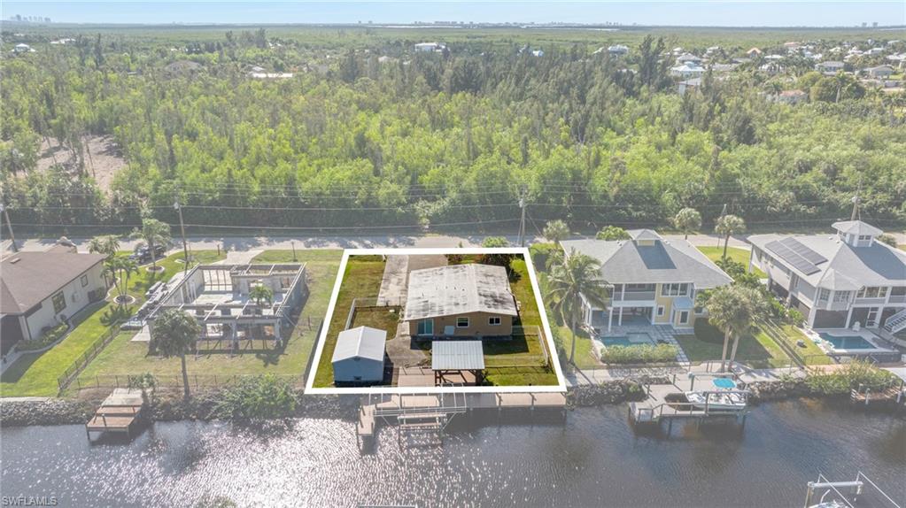 5800 Park Road Fort Myers, FL 33908 - Photo 8 of 18 an aerial view of residential houses with outdoor space