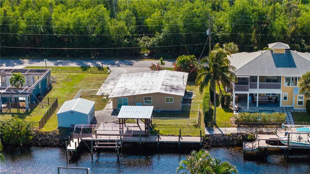 5800 Park Road Fort Myers, FL 33908 - Photo 10 of 18 a view of swimming pool with outdoor seating and a garden