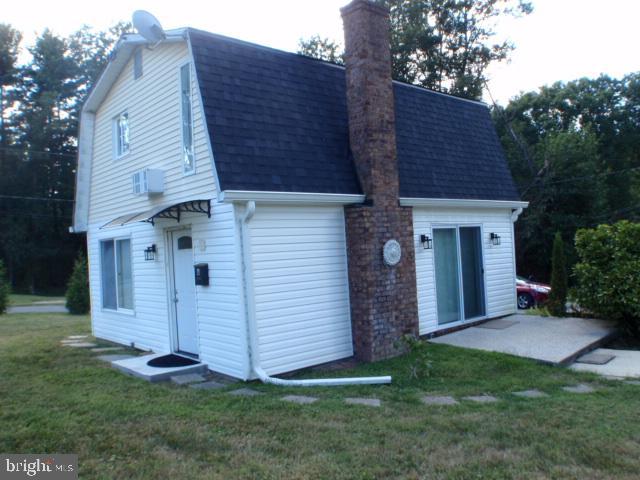 2022 Brown Road, Unit A Finksburg, MD 21048 - Photo 1 of 13 a front view of a house with a garden