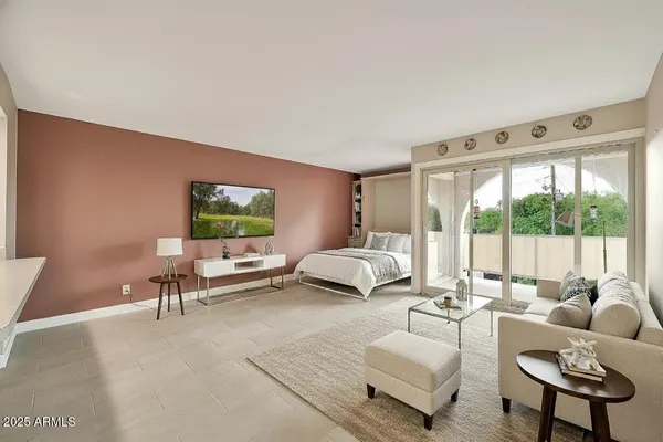 a living room with furniture and a large window