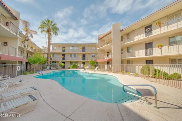 a view of a swimming pool with a patio