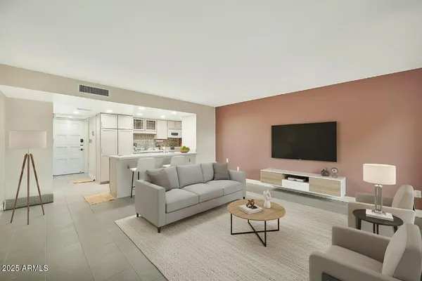 a living room with furniture and a flat screen tv