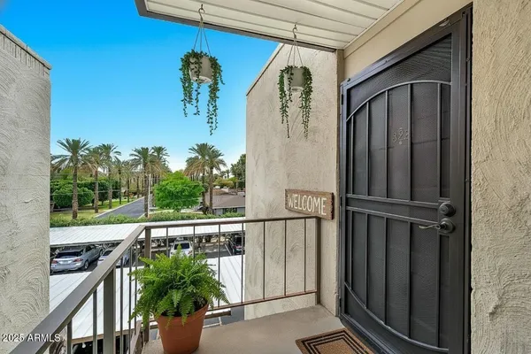 a view of balcony with furniture