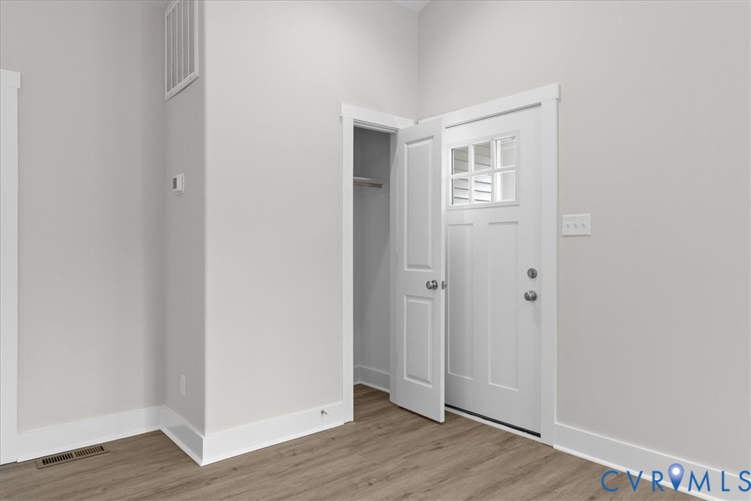 447 Raleigh Avenue South Hill, VA 23970 - Photo 11 of 31 a view of an empty room with wooden floor