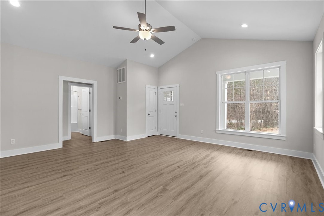 447 Raleigh Avenue South Hill, VA 23970 - Photo 12 of 31 a view of an empty room with wooden floor and a window