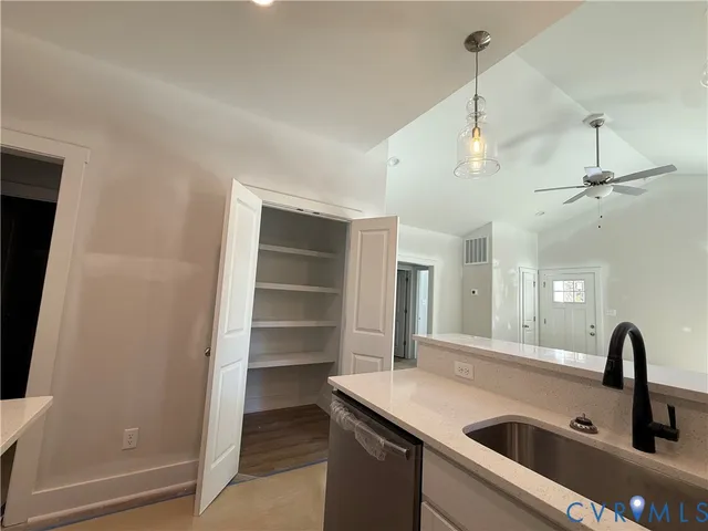 a kitchen with a sink and a refrigerator