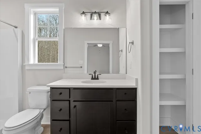 a view of an empty walk in closet