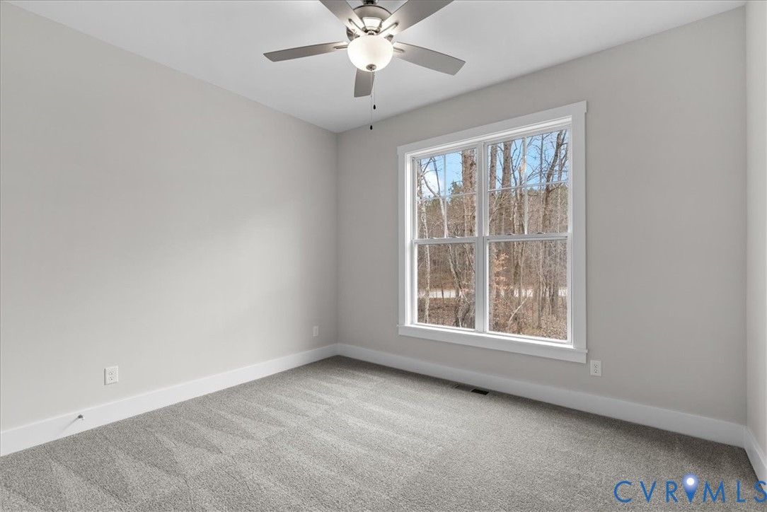447 Raleigh Avenue South Hill, VA 23970 - Photo 26 of 31 an empty room with a window and a ceiling fan