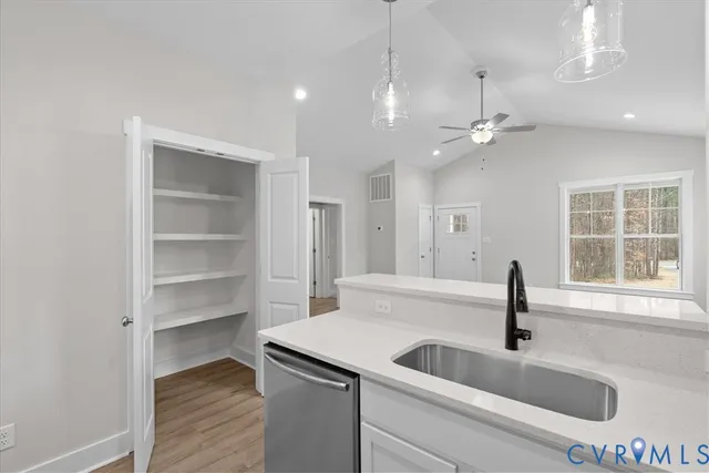 a kitchen with a sink and a large window