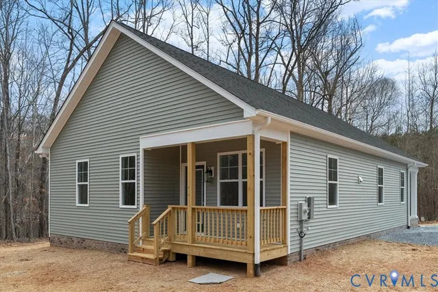 a view of backyard with deck and backyard